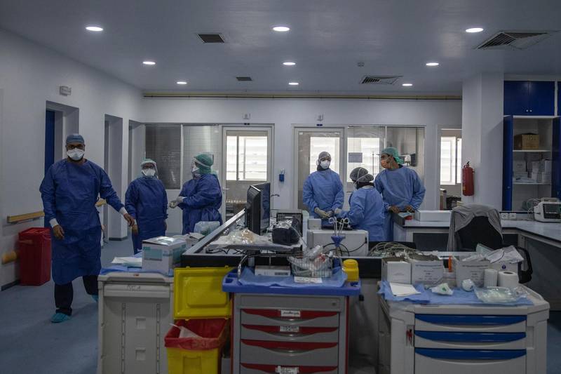 In this photo taken on Wednesday, April 15, 2020, healthcare workers stand inside one of the COVID-19 intensive care units (ICU) of the Moulay Abdellah hospital in Sale, Morocco. Coronavirus has upended life for Morocco's medical workers. They enjoy better medical facilities than in much of Africa but are often short of the equipment available in European hospitals, which also found themselves overwhelmed. (AP Photo/Mosa'ab Elshamy)