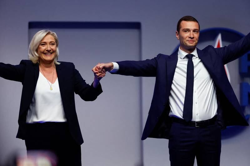 Jordan Bardella, right, is succeeding Marine Le Pen as leader of the National Rally. Reuters