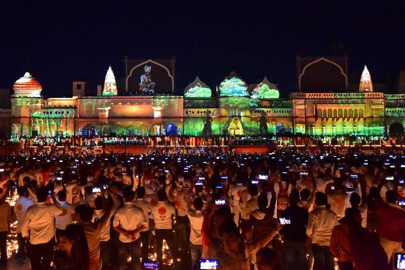 People watch a light show on the banks of the Sarayu River on the eve of Diwali in Ayodhya, India. AFP