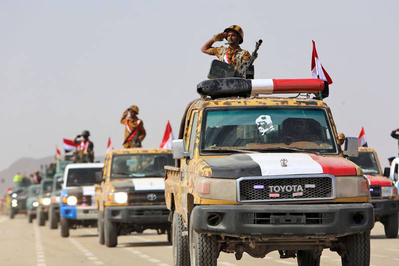 Fighters loyal to Yemen's Saudi-backed government take part in a military parade marking the 56th anniversary of the 1962 revolution that established the Yemeni republic, in the country's northeastern province of Marib. All photos by AFP