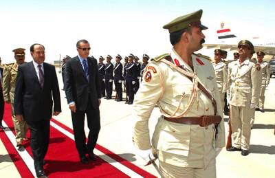 Prime minister Nouri Al Maliki receives Turkish prime minister Recep Tayyip Erdogan, centre, at Baghdad airport on July 10, 2008.