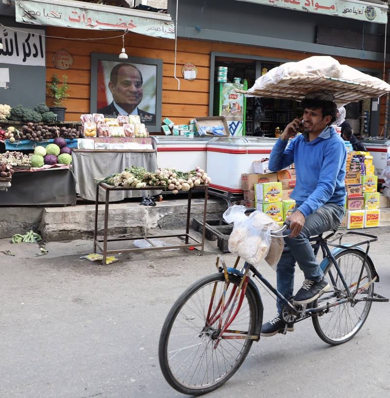 A bakery worker delivering bread in Cairo. EPA