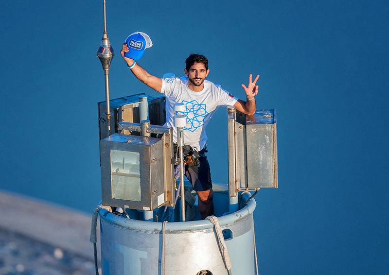 Sheikh Hamdan stands on top of the Burj Khalifa. AFP 