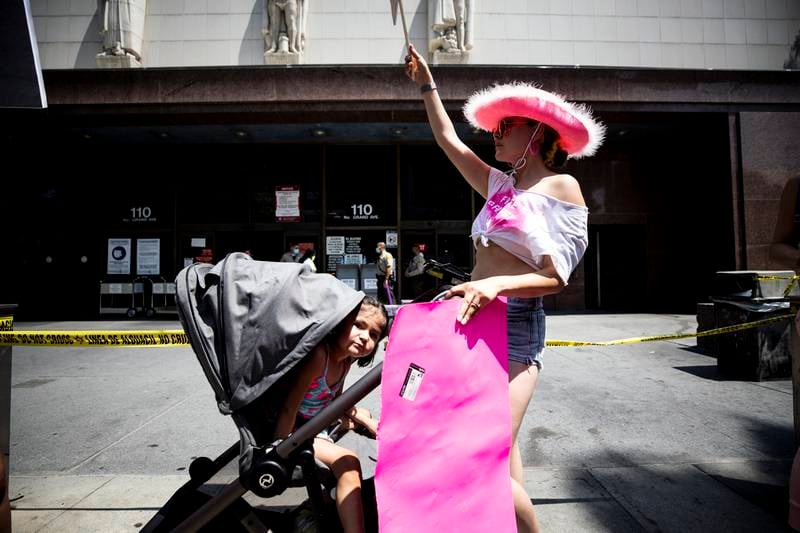A demonstrator reacts during a #FreeBritney protest in front of the court house where a hearing is scheduled in the Britney Spears' conservatorship case in Los Angeles, California.