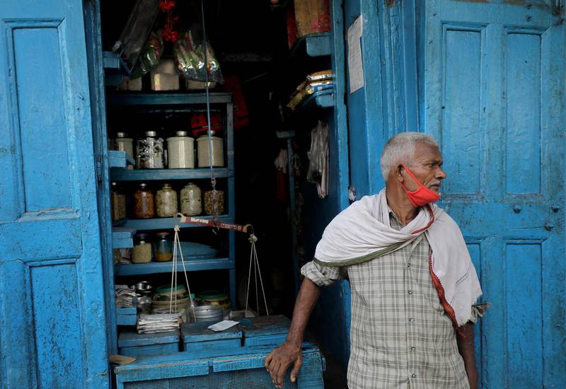 A dry food vendor waits for customers at his street food shop in Kolkata, Eastern India, October 9. Piyal Adhikary / EPA