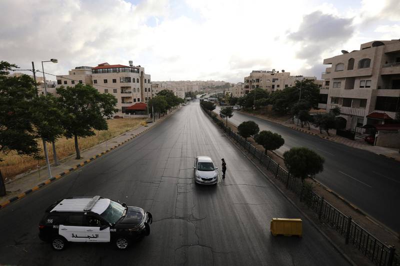 A Jordanian police officer works at a checkpoint during the first day of Eid in Amman, Jordan. Reuters