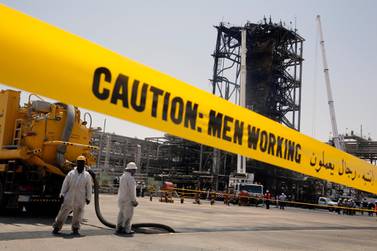 Saudi Aramco employees work on restoring production at the company's oil processing facility in Khurais following the missile and drone attacks last weekend. AP Photo