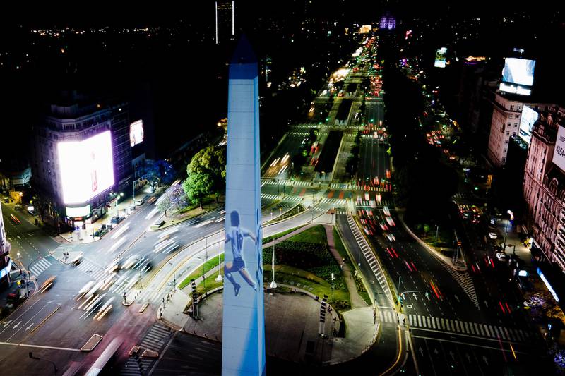 The Obelisk of Buenos Aires lights up with the colours of the Argentinian flag and images of Maradona. Getty