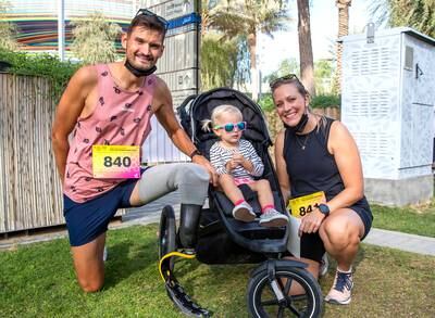 Para-triathlete Sebastian Engwald with his daughter, Anna, and wife, Pia, at the charity run