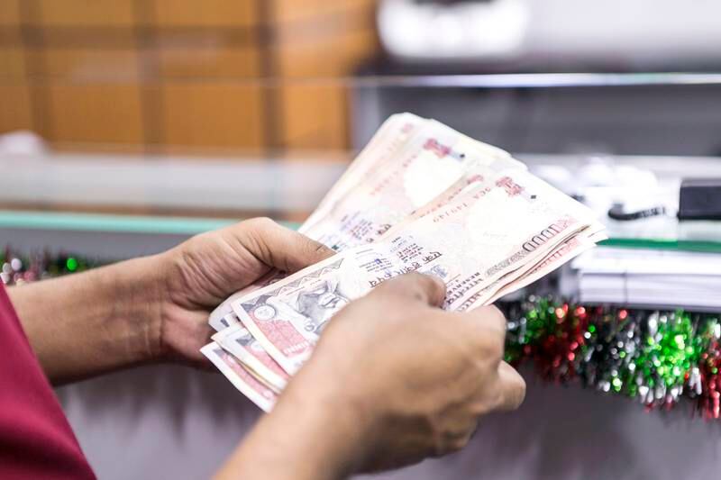 ABU DHABI, UNITED ARAB EMIRATES, 1 DEC 2015. After slump in rupee value, now, 1 Dirham fetches over 18 Indian rupees. Photo: Reem Mohammed/ The National (Reporter: Anwar Ahmad Section: NA) ID: 87257 *** Local Caption ***  RM_20151201_REMITTANCE_007.JPG
