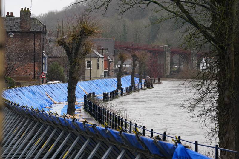 Flood barriers are erected along the River Severn in Ironbridge, Shropshire. PA