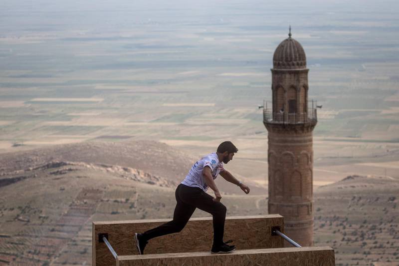A competitor warms up ahead of the start of the Speed category during the second round of the World Parkour Championships in Mardin, Turkey. Chris McGrath / Getty Images