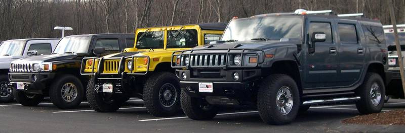 Hummers gathered in a car park.