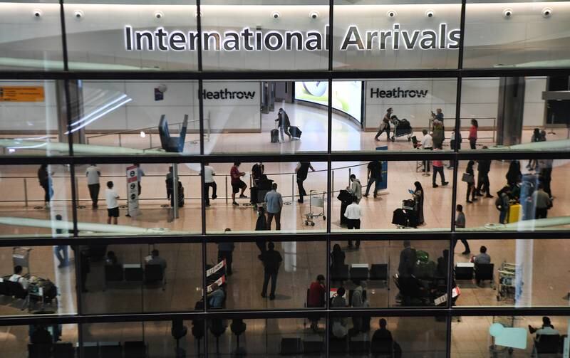 File photo: Passengers arrive at Heathrow Airport in London, Britain, 21 August 2020. EPA