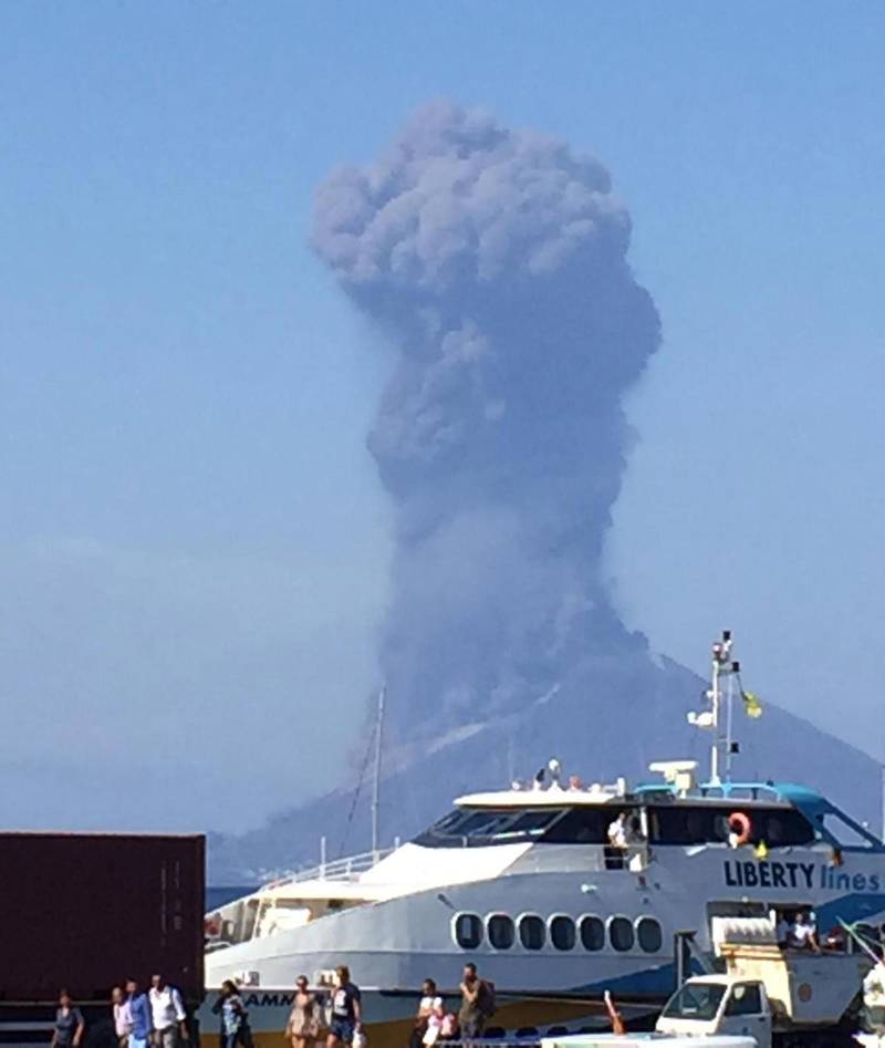 Ash rises into the sky after a volcano eruption on a small island of Stromboli, Italy.  According to reports, the island of Stromboli was hit by a set of violent volcano eruptions spurring beach tourists to take into the sea. Two new lava spouts are creeping down the volcano.  EPA