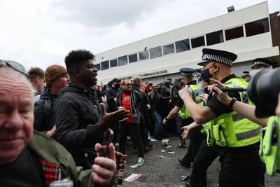 United fans clash with police outside of Old Trafford. Reuters