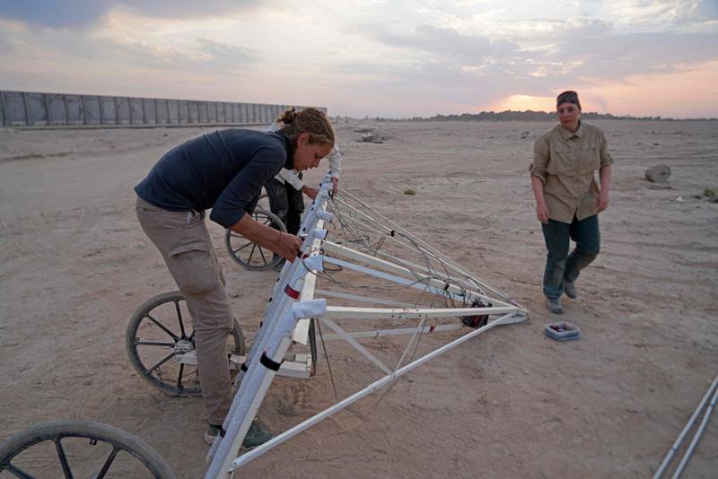 Members of a German-Iraqi archaeological expedition set up geophysical survey equipment at Iraq's ancient site of Al-Hirah, about 25 kilometres south of Najaf.