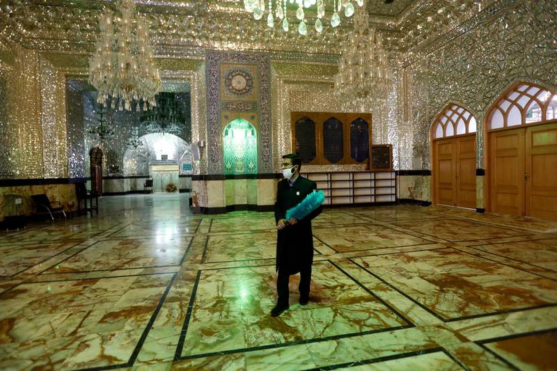 epa08443847 An Iranian official walks around the tomb of the Abdol Azim inside the shrine in the city of Shahre Ray, south of the capital city Tehran, Iran, 25 May 2020. Media reported that Iran reopened its holy shrines in the country amid the coronavirus pandemic, but people can't gather inside and around the tomb.  EPA/ABEDIN TAHERKENAREH