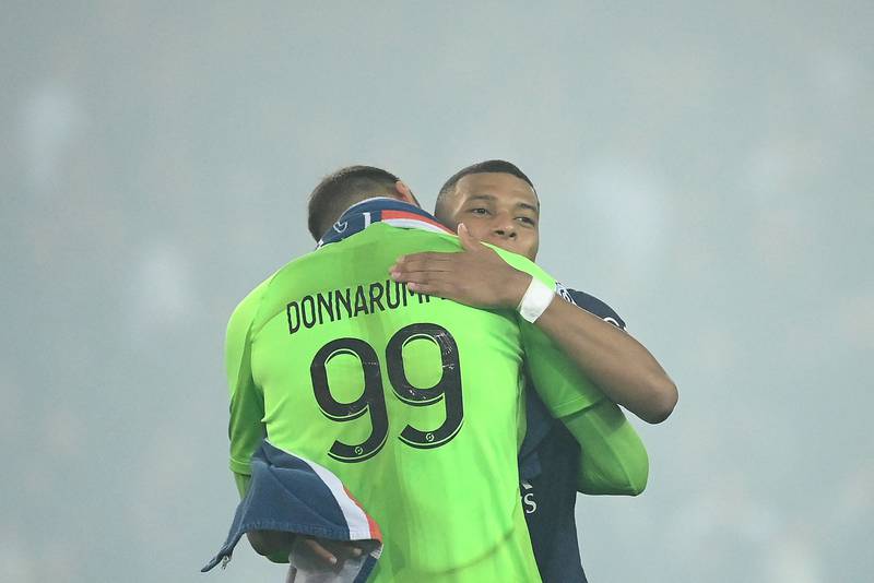 Paris Saint-Germain's Italian goalkeeper Gianluigi Donnarumma hugs Paris Saint-Germain's French forward Kylian Mbappe. AFP