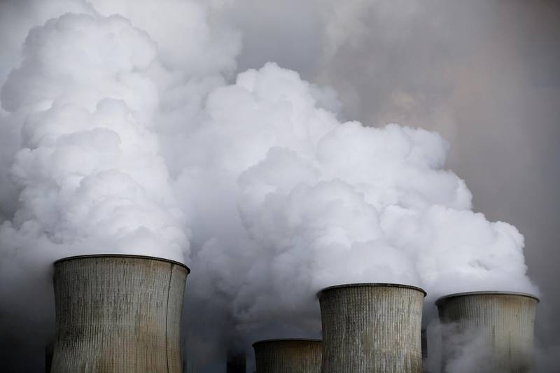 FILE PHOTO: Steam rises from the cooling towers of the coal power plant of RWE, one of Europe's biggest electricity and gas companies in Niederaussem, Germany,  March 3, 2016. REUTERS/Wolfgang Rattay/File Photo