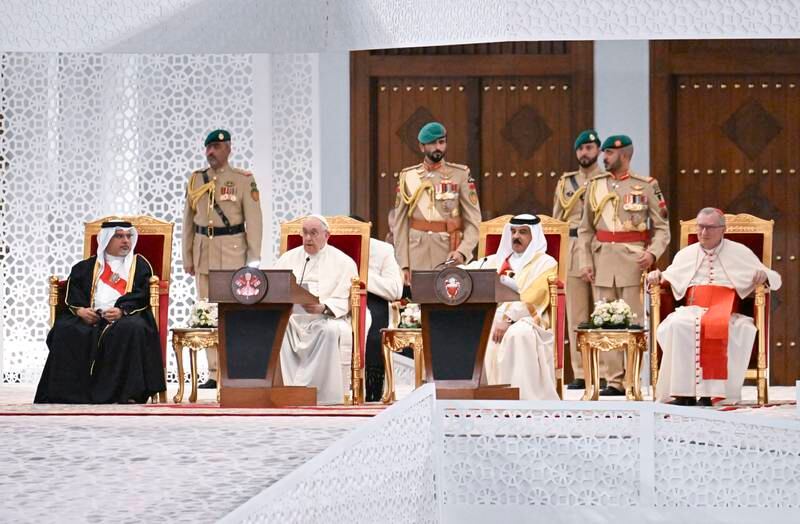 Pope Francis, flanked by King Hamad and Bahrain's Prince Salman bin Hamad, left, delivers his speech during their meeting at the palace. EPA