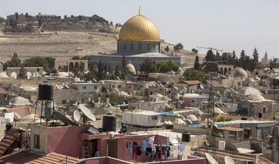 The Dome of the Rock, in the old city of Jerusalem, and the ancient Jewish cemetery on Mount of Olives in the background. Unesco passed a resolution that denies the Jewish link to the Temple Mount and the Western Wall.  Atef Safadi / EPA