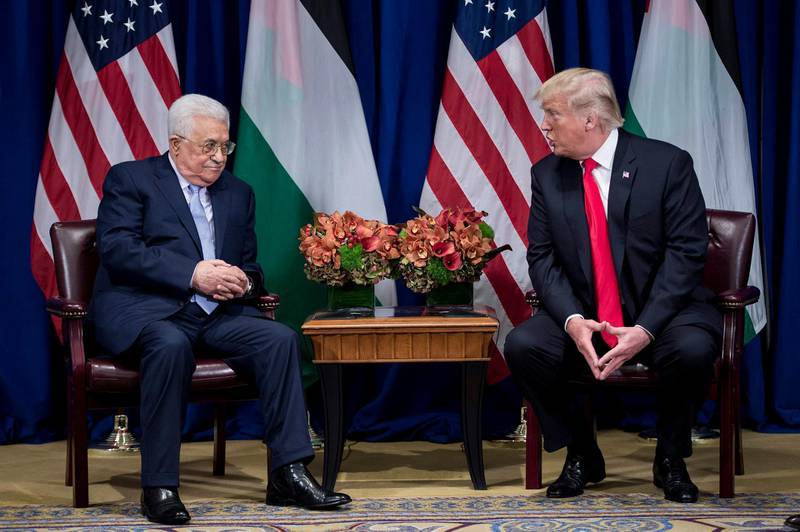 Palestinian Authority President Mahmoud Abbas listens while US President Donald Trump makes a statement for the press before a meeting at the Palace Hotel during the 72nd United Nations General Assembly on September 20, 2017, in New York. / AFP PHOTO / Brendan Smialowski