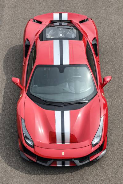 The exterior is replete with tip-to-tail racing stripe. Ferrari