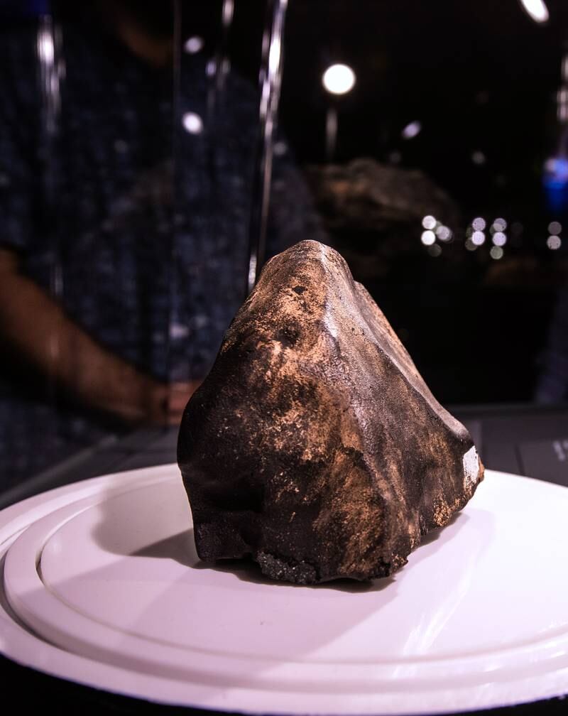 The seven-billion-year-old Murchison meteorite can be viewed at a new exhibition of the Natural History Museum Abu Dhabi's collection. Victor Besa / The National