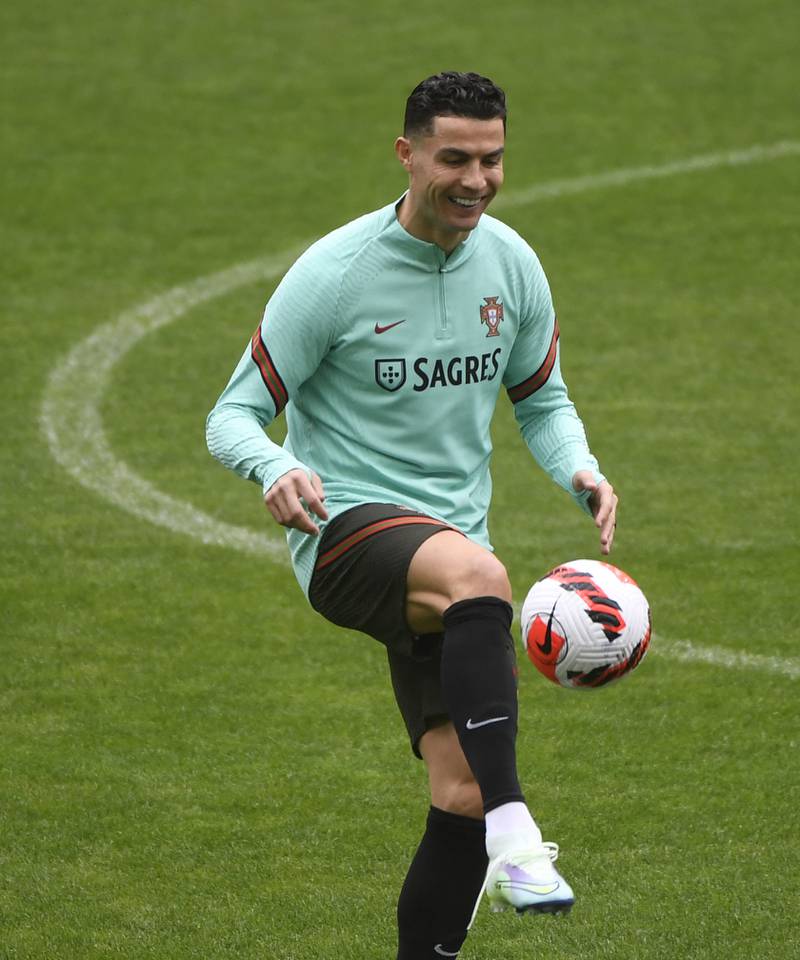 Cristiano Ronaldo juggles the ball at Portugal training. AFP