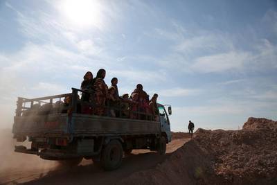 People fleeing areas of conflict ride a vehicle, north of Raqqa city, Syria November 8, 2016. REUTERS/Rodi Said