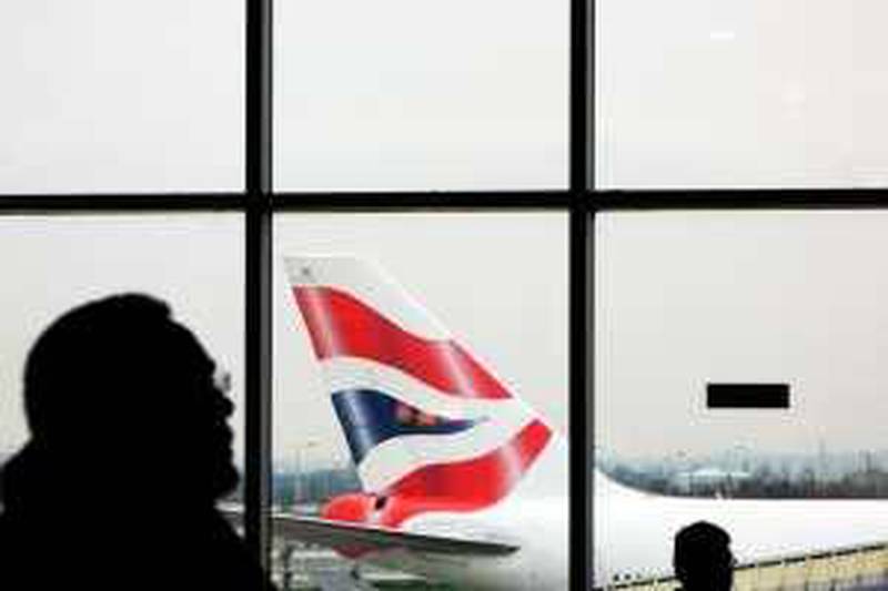 A British Airways plane is pictured outside Terminal 4 at London's Heathrow airport, 29 January 2007. British Airways held last-ditch talks with unions Monday aimed at heading off a two-day cabin crew strike which threatens passenger chaos and a huge bill for the airline. The talks, with BA battling to prevent the the cancellation of over 1,000 flights Tuesday and Wednesday, resumed after failing to make headway over the weekend, said a company spokesman. Industry analysts have estimated that the walkout will cost BA around 30 million pounds (60 million dollars, 45 million euros) in lost revenue and other expenditure. In addition it could also cost the wider economy 2,5 million pounds a day, said one business analyst.