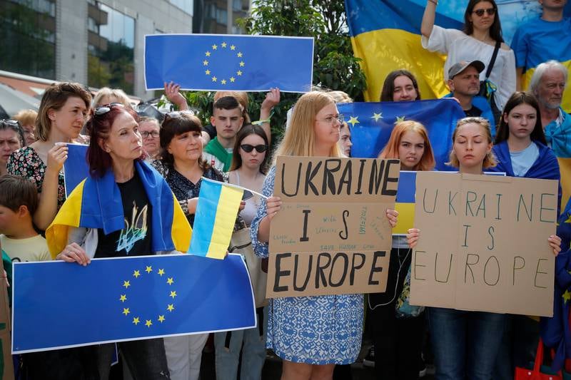 Supporters of Ukraine's EU membership demonstrate outside the summit venue in Brussels. EPA