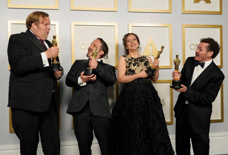Best Sound Mixing: Phillip Bladh, Carlos Cortes, Michellee Couttolenc and Jaime Baksht, for 'Sound of Metal', pose in the press room at the Oscars on Sunday, April 25, 2021, at Union Station in Los Angeles. AP Photo