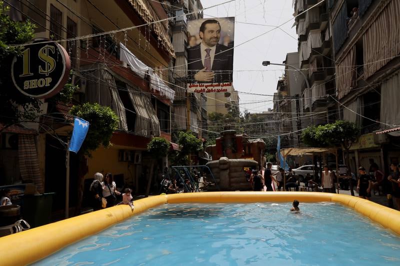 Supporters of former prime minister Saad Hariri set up an inflatable swimming pool in the Tarik El Jdideh neighborhood of Beirut, as they boycott Lebanon's elections. Getty