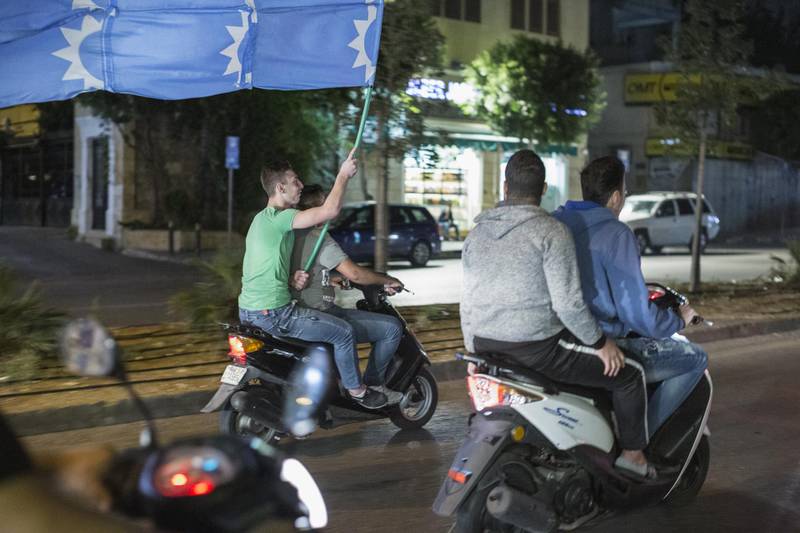 Supporters of Lebanese Prime Minister Saad al Hariri ride their scooters in a convoy to show support. Getty Images