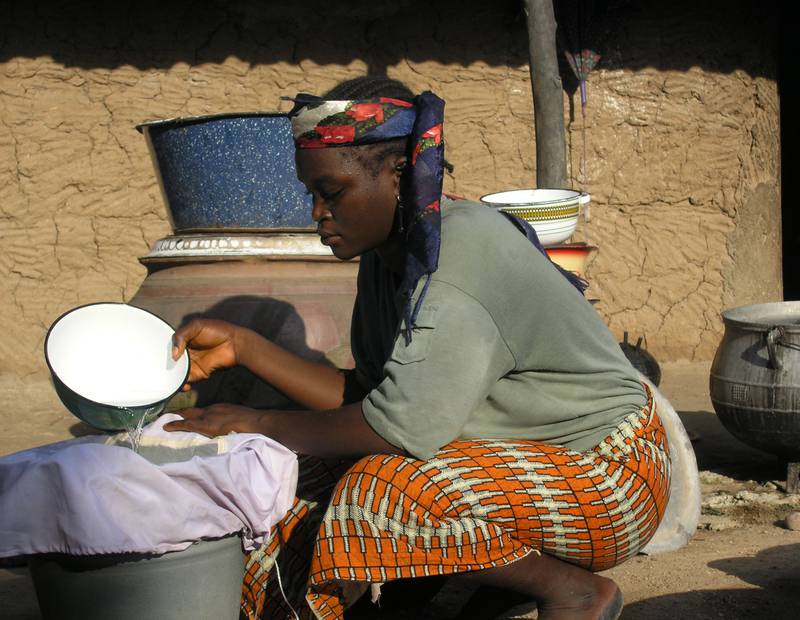 A woman in Nigeria filters drinking water using a simple cloth filter. Nigeria, previously the world’s most endemic country, reported its last case of Guinea worm disease in 2008.