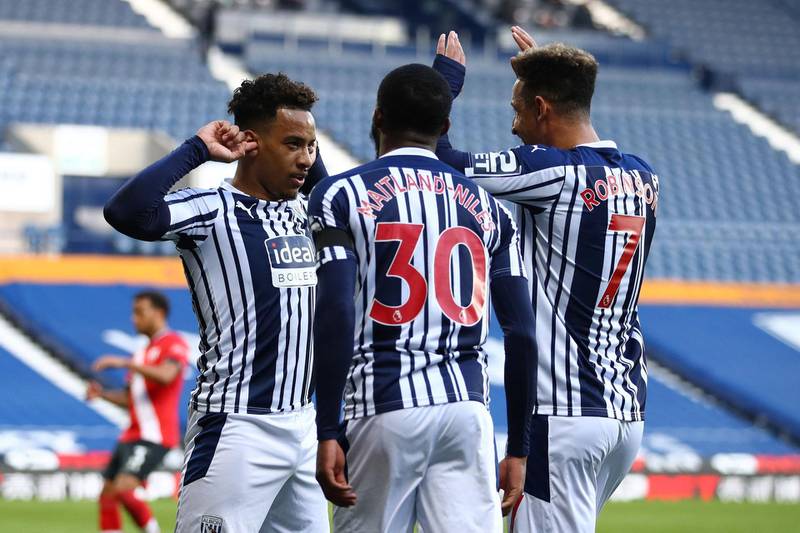 West Bromwich Albion's Brazilian midfielder Matheus Pereira (L) celebrates with teammates after scoring the opening goal from the penalty spot during the English Premier League football match between West Bromwich Albion and Southampton at The Hawthorns stadium in West Bromwich, central England, on April 12, 2021.  - RESTRICTED TO EDITORIAL USE. No use with unauthorized audio, video, data, fixture lists, club/league logos or 'live' services. Online in-match use limited to 120 images. An additional 40 images may be used in extra time. No video emulation. Social media in-match use limited to 120 images. An additional 40 images may be used in extra time. No use in betting publications, games or single club/league/player publications.
 / AFP / POOL / Michael Steele / RESTRICTED TO EDITORIAL USE. No use with unauthorized audio, video, data, fixture lists, club/league logos or 'live' services. Online in-match use limited to 120 images. An additional 40 images may be used in extra time. No video emulation. Social media in-match use limited to 120 images. An additional 40 images may be used in extra time. No use in betting publications, games or single club/league/player publications.
