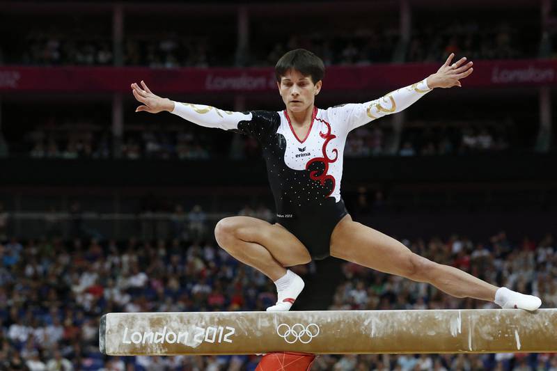 Germany's Oksana Chusovitina performs on the beam during the women's qualification of the artistic gymnastics event of the London Olympic Games on July 29, 2012 at the O2 North Greenwich Arena in London.