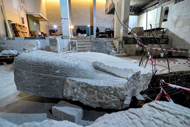 A large part of a broken statue of the ancient Mesopotamian "lamassu" human-headed winged bull at the Mosul Museum. Photo: AFP