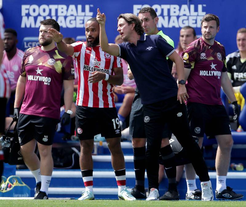 Brentford manager Thomas Frank gives instructions to Bryan Mbeumo. PA