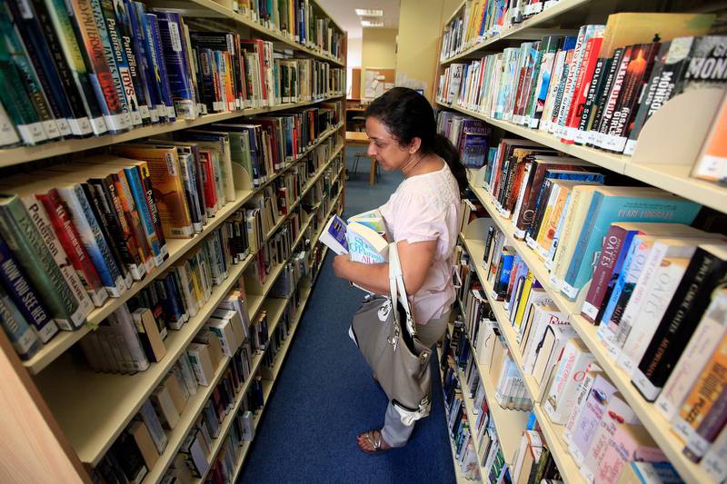 Dubai, United Arab Emirates- July 12, 2012;  A visitor browses the books at the Old Library  in  Dubai  . (  Satish Kumar / The National ) For Arts & Life
