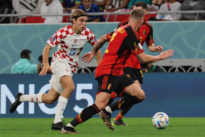 Croatia's defender Borna Sosa fights for the ball against Belgium at the Ahmad Bin Ali Stadium. AFP
