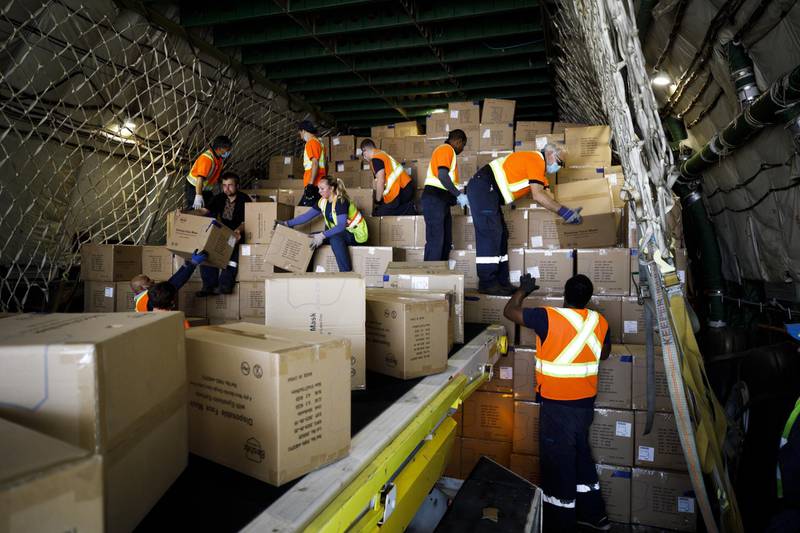 Workers unload a shipment of medical supplies. Bloomberg