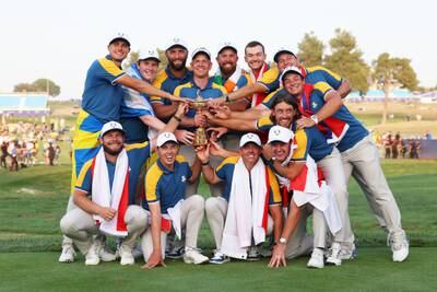 Luke Donald, captain of Team Europe and players of Team Europe pose with the Ryder Cup trophy following victory at Marco Simone Golf Club. Getty