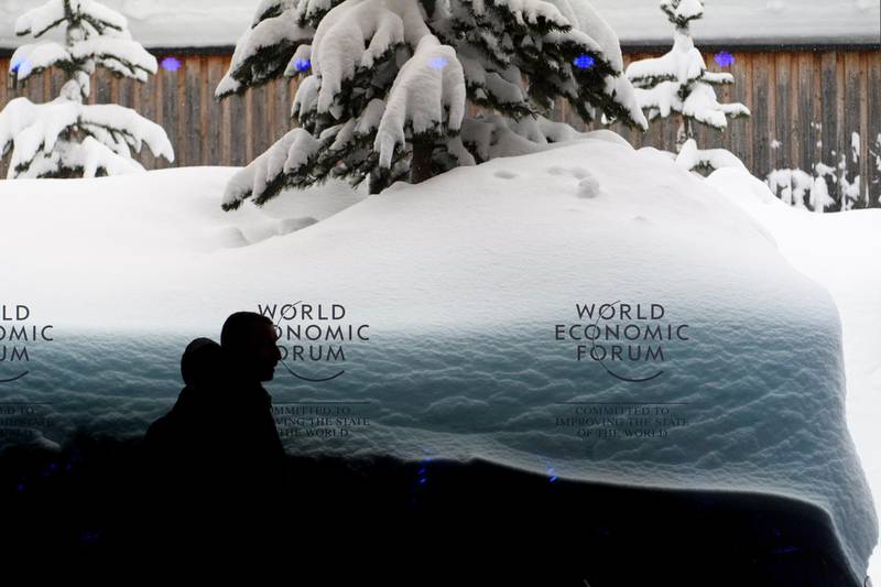 epa06460811 A WEF logo on a window of the Congress Center in front of snow covered trees two days prior to the 48th Annual Meeting of the World Economic Forum, WEF, in Davos, Switzerland, Sunday, January 21, 2018. The meeting brings together enterpreneurs, scientists, chief executive and political leaders in Davos January 23 to 26.  EPA/LAURENT GILLIERON