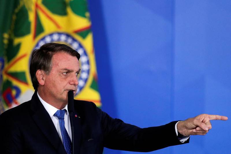 Brazil's President Jair Bolsonaro gestures during the launching ceremony of the Voo Simples program, which are a set of measures to modernize rules and reduce costs in the general aviation sectors, at the Planalto Palace in Brasilia, Brazil, October 7, 2020. REUTERS/Ueslei Marcelino