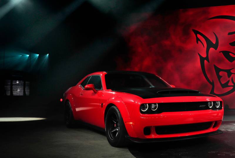 FILE- This April 11, 2017, file photo shows the 2018 Dodge Challenger SRT Demon during a media preview for the New York International Auto Show in New York. This limited-edition variant boasts a maximum 840 horsepower and various modifications to improve straight-line acceleration. (AP Photo/Julie Jacobson, File)