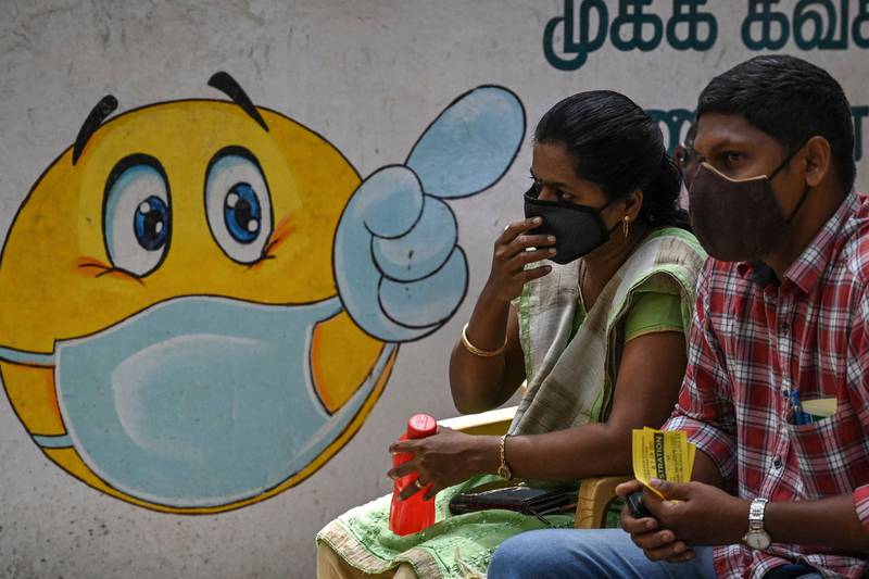 People wait to get inoculated with a dose of the Covid-19 vaccine at a school in south Indian city of Chennai. AFP