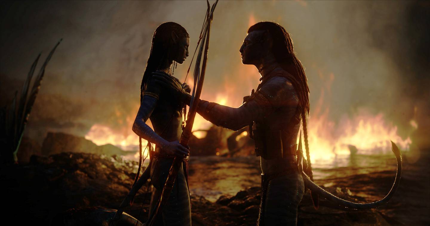 Zoe Saldana as Neytiri, left, and Sam Worthington as Jake Sully in Avatar: The Way of Water. 20th Century Studios via AP